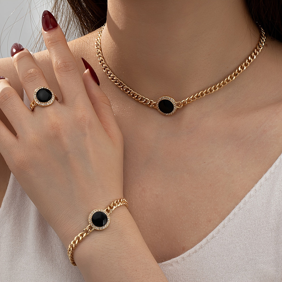 A set of simple and elegant black round necklace, ring, bracelet, three-piece set